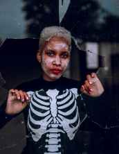 woman wearing skeleton costume